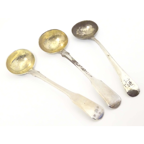 440 - A pair of Geo III silver fiddle pattern salt spoons Hallmarked London 1810 maker AH. 
Together with ... 
