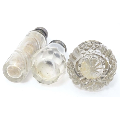 584 - Two small silver lidded glass scent / perfume bottles hallmarked London 1904 makers Henry Perkins & ... 