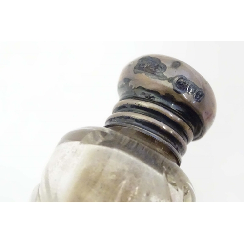 584 - Two small silver lidded glass scent / perfume bottles hallmarked London 1904 makers Henry Perkins & ... 