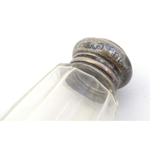 584 - Two small silver lidded glass scent / perfume bottles hallmarked London 1904 makers Henry Perkins & ... 