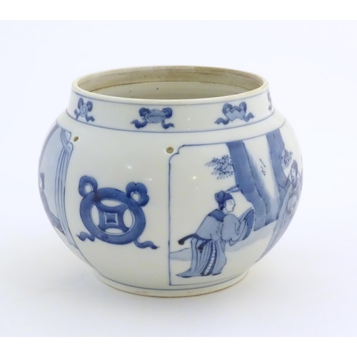 38 - A Chinese blue and white planter with four drilled hanging holes, decorated with panelled decoration... 