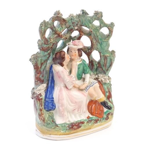 80 - A Victorian Staffordshire pottery flat back figural group depicting Romeo and Juliet within a foliat... 