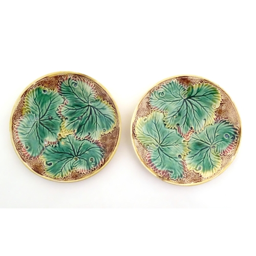 89 - Four Victorian majolica leaf plates of circular form two with Begonia leaves, and two with strawberr... 