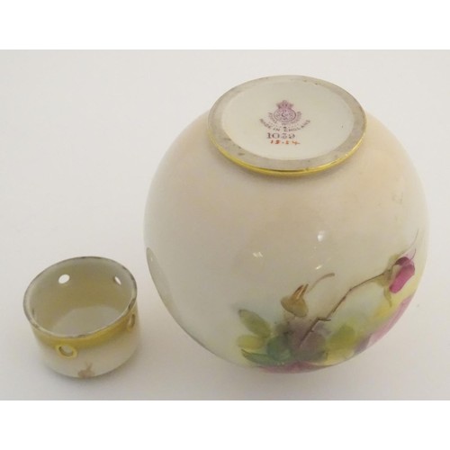 130 - An early 20thC Royal Worcester pot pourri and cover of globular form, with rose decoration. Bears si... 