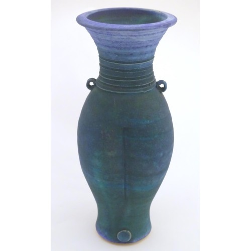 164 - A 20thC studio pottery barium glaze vase by Simon Shaw, with a bulbous body and a flared rim, the ne... 