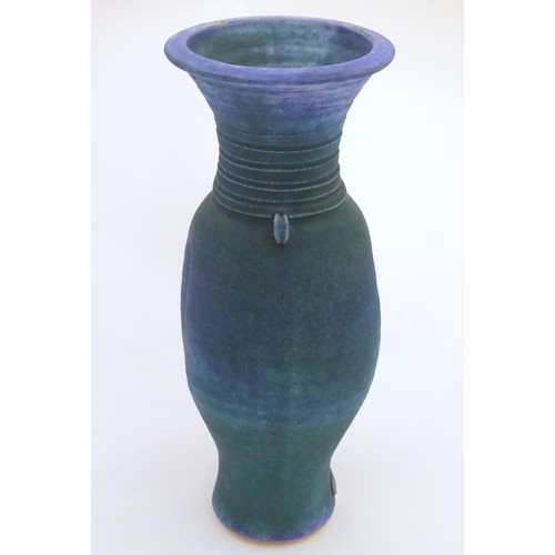 164 - A 20thC studio pottery barium glaze vase by Simon Shaw, with a bulbous body and a flared rim, the ne... 