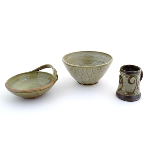 170 - Three assorted studio pottery items to include a bowl with an applied single handle, inscribed under... 