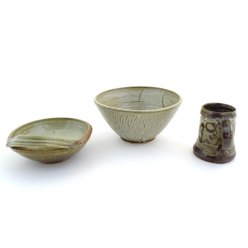 170 - Three assorted studio pottery items to include a bowl with an applied single handle, inscribed under... 