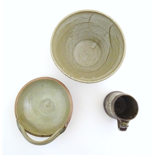 170 - Three assorted studio pottery items to include a bowl with an applied single handle, inscribed under... 