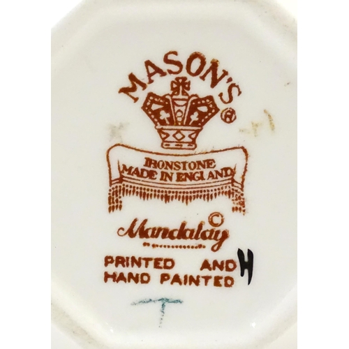 180 - Three Mason's ironstone items in the pattern Mandalay to include a mantel clock, a jug and a vase. E... 