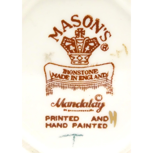 180 - Three Mason's ironstone items in the pattern Mandalay to include a mantel clock, a jug and a vase. E... 