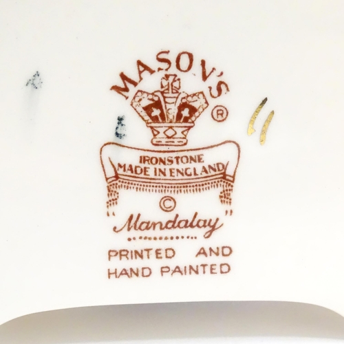 180 - Three Mason's ironstone items in the pattern Mandalay to include a mantel clock, a jug and a vase. E... 