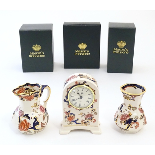 180 - Three Mason's ironstone items in the pattern Mandalay to include a mantel clock, a jug and a vase. E... 