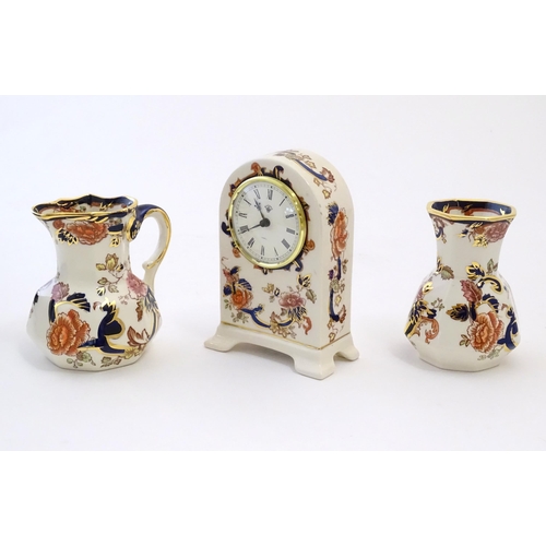 180 - Three Mason's ironstone items in the pattern Mandalay to include a mantel clock, a jug and a vase. E... 