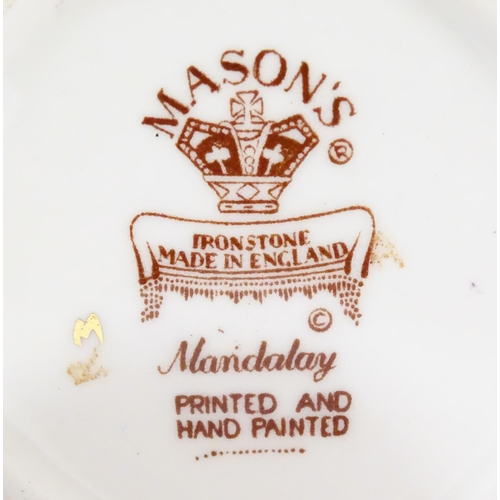 180 - Three Mason's ironstone items in the pattern Mandalay to include a mantel clock, a jug and a vase. E... 