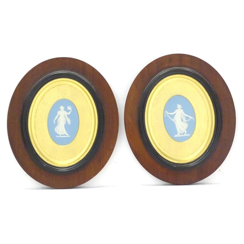 188 - A pair of 19thC Wedgwood jasperware blue and white oval plaques depicting classical maidens, one wit... 