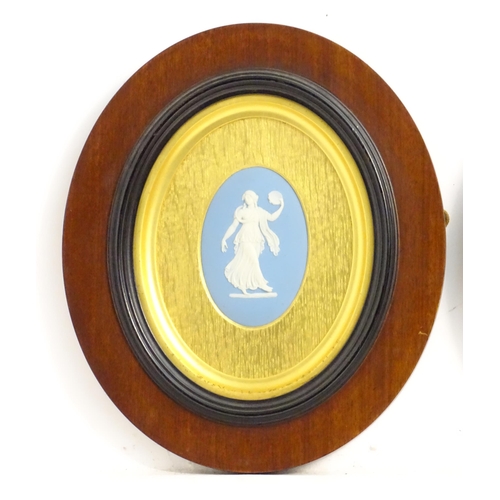 188 - A pair of 19thC Wedgwood jasperware blue and white oval plaques depicting classical maidens, one wit... 