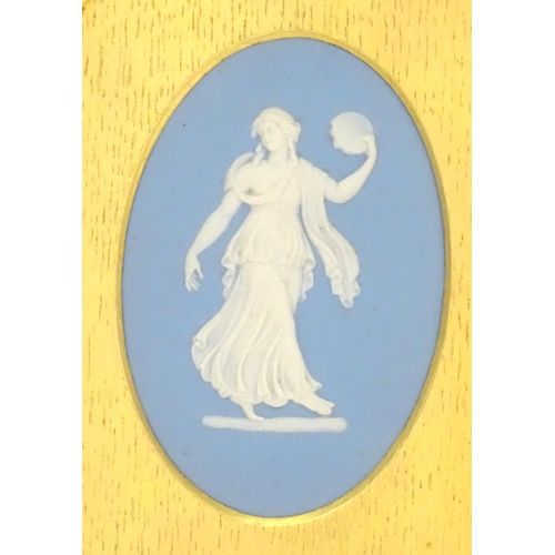 188 - A pair of 19thC Wedgwood jasperware blue and white oval plaques depicting classical maidens, one wit... 