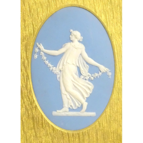 188 - A pair of 19thC Wedgwood jasperware blue and white oval plaques depicting classical maidens, one wit... 