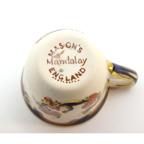 212 - A large quantity of Mason's ironstone tea wares in the Mandalay pattern to include lamp base, wall c... 