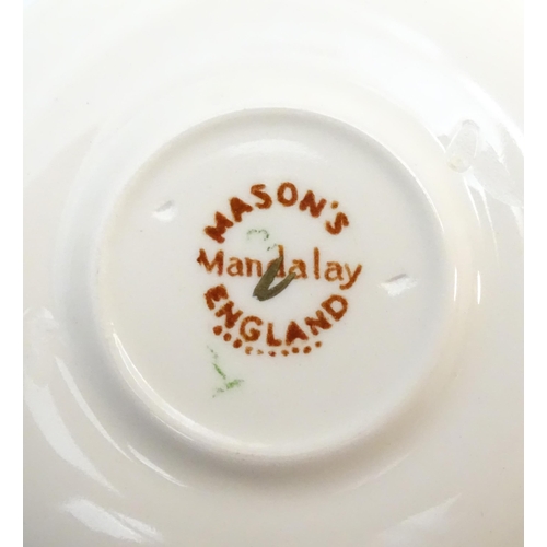 212 - A large quantity of Mason's ironstone tea wares in the Mandalay pattern to include lamp base, wall c... 