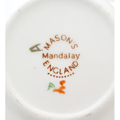 212 - A large quantity of Mason's ironstone tea wares in the Mandalay pattern to include lamp base, wall c... 