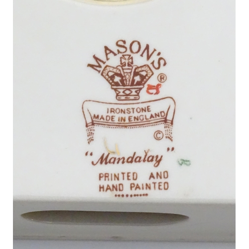 212 - A large quantity of Mason's ironstone tea wares in the Mandalay pattern to include lamp base, wall c... 