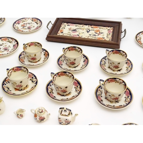 212 - A large quantity of Mason's ironstone tea wares in the Mandalay pattern to include lamp base, wall c... 