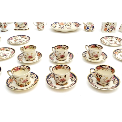 212 - A large quantity of Mason's ironstone tea wares in the Mandalay pattern to include lamp base, wall c... 