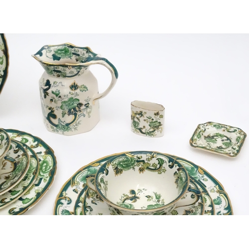 216 - A quantity of Mason's dinner wares in the pattern Chartreuse, to include chambersticks, plates, side... 