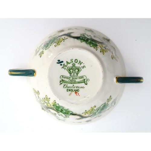 216 - A quantity of Mason's dinner wares in the pattern Chartreuse, to include chambersticks, plates, side... 