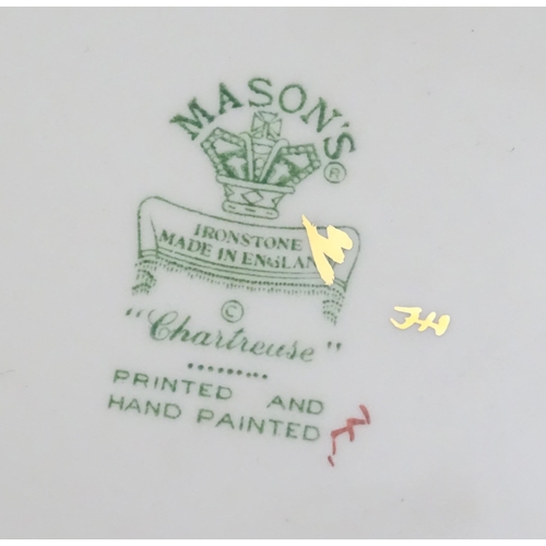 216 - A quantity of Mason's dinner wares in the pattern Chartreuse, to include chambersticks, plates, side... 