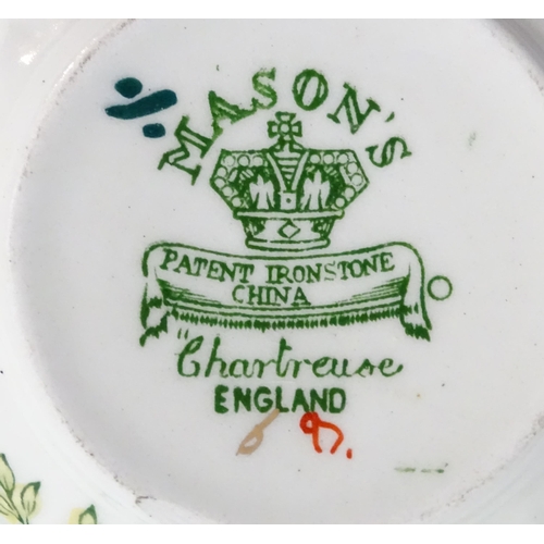 216 - A quantity of Mason's dinner wares in the pattern Chartreuse, to include chambersticks, plates, side... 