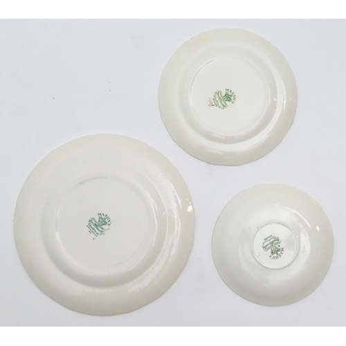 216 - A quantity of Mason's dinner wares in the pattern Chartreuse, to include chambersticks, plates, side... 