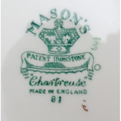 216 - A quantity of Mason's dinner wares in the pattern Chartreuse, to include chambersticks, plates, side... 