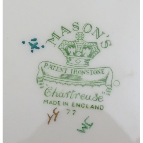 216 - A quantity of Mason's dinner wares in the pattern Chartreuse, to include chambersticks, plates, side... 