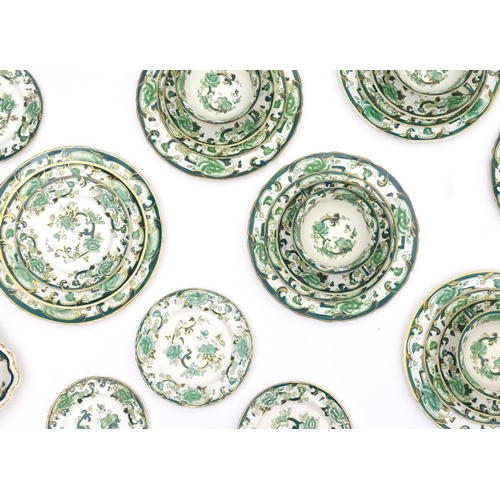 216 - A quantity of Mason's dinner wares in the pattern Chartreuse, to include chambersticks, plates, side... 