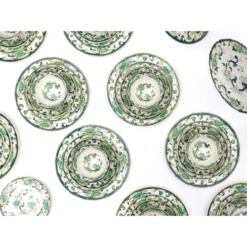 216 - A quantity of Mason's dinner wares in the pattern Chartreuse, to include chambersticks, plates, side... 