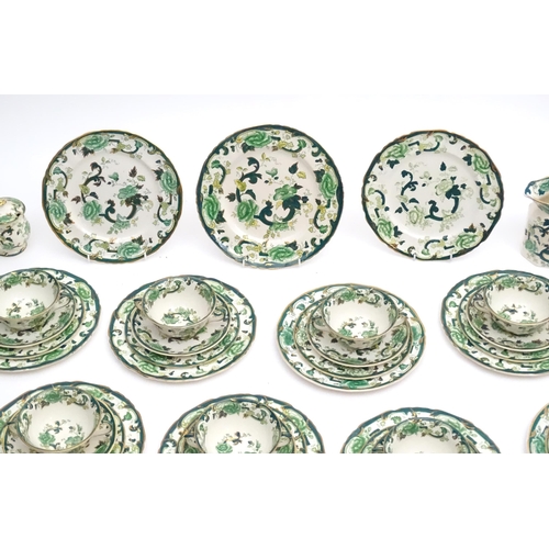 216 - A quantity of Mason's dinner wares in the pattern Chartreuse, to include chambersticks, plates, side... 