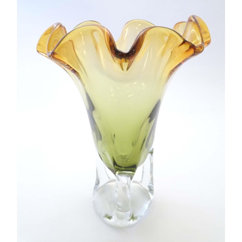 244 - A studio glass vase with amber flared rim and body on a open clear glass base. Approx 11