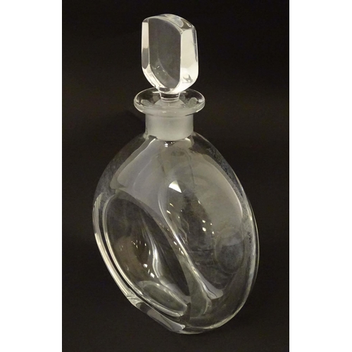 254 - Orrefors : A Swedish glass decanter and stopper signed and numbered under. Approx 24