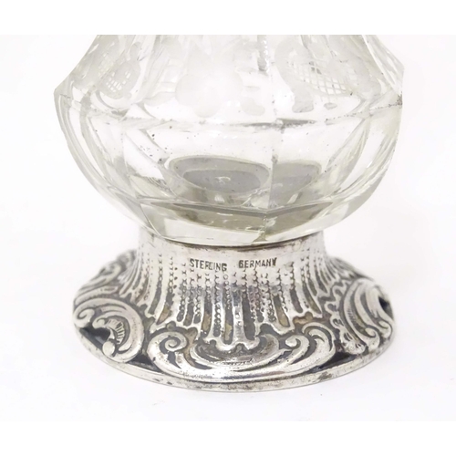 384 - A Continental cut glass pepper pot engraved floral and foliate detail and silver mounts, marked Ster... 