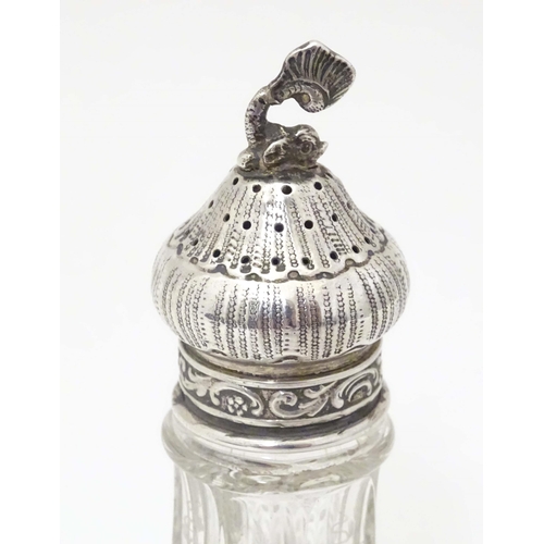 384 - A Continental cut glass pepper pot engraved floral and foliate detail and silver mounts, marked Ster... 