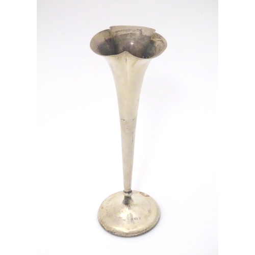 397 - A silver bud vase of fluted form, hallmarked Birmingham 1900. Approx. 8