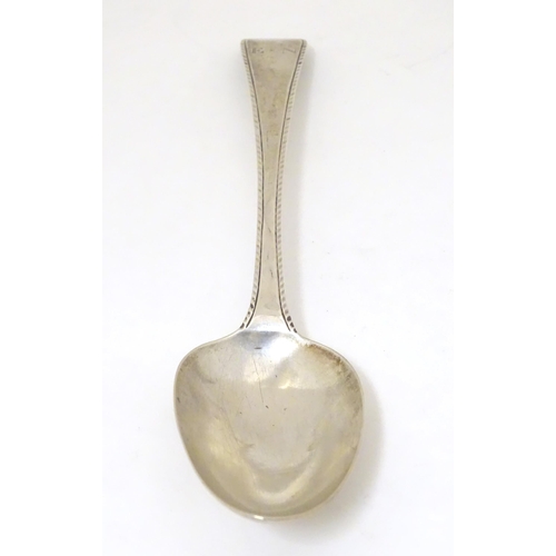 470 - A 19thC silver feather edge tablespoon, hallmarked London 1780 maker John Lambe. Approx 8 1/2