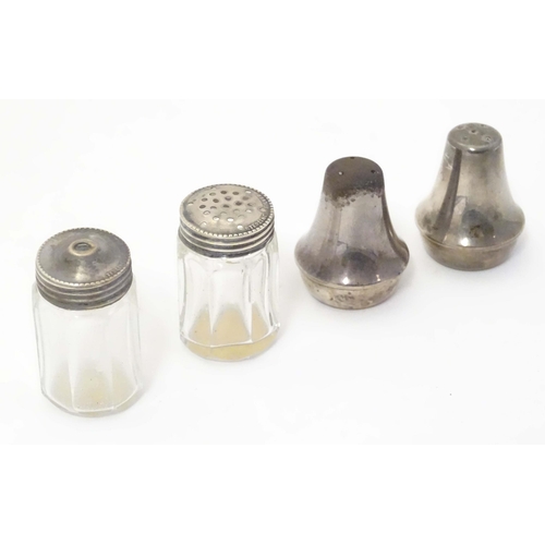 474 - A cut glass salt and pepper pots with silver tops, together with two Mexican silver small salt and p... 