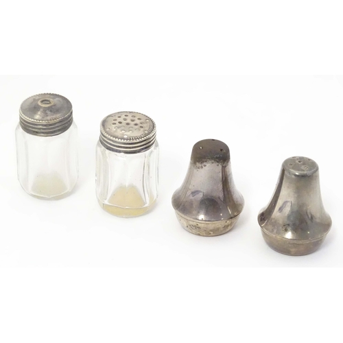 474 - A cut glass salt and pepper pots with silver tops, together with two Mexican silver small salt and p... 