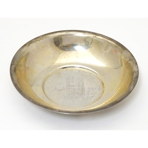 475 - A silver souvenir dish with central medallion commemorating the silver wedding anniversary of HRH Qu... 