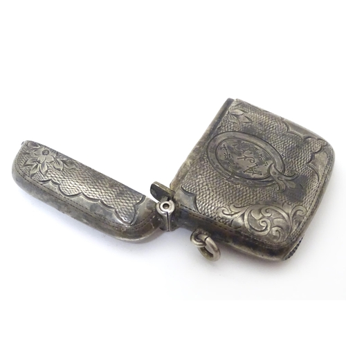 477 - A silver vesta case with engraved decoration hallmarked Birmingham 1904, maker William J. Holmes. Ap... 