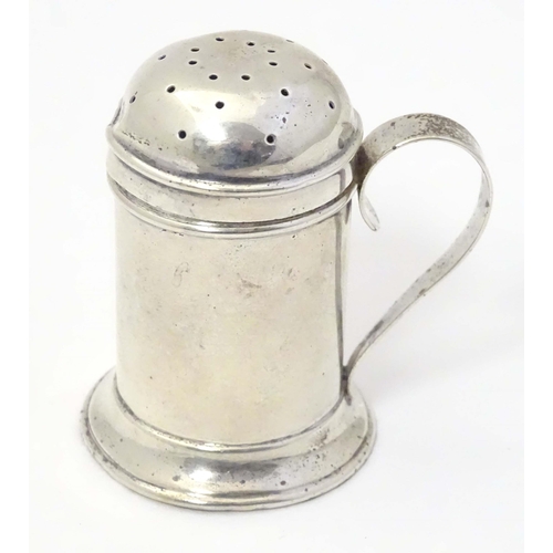 483 - A silver pepper formed as a flour shaker with loop handle. Hallmarked Birmingham 1901 maker Thomas D... 